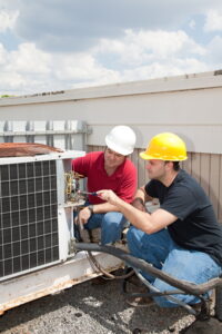 commercial-HVAC-technicians-working-on-a-rooftop-HVAC-unit